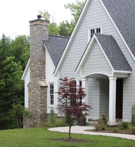 houses with grey metal roofs|gray house with dark trim.